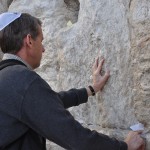 Placing my prayer into a niche in the Wailing Wall.