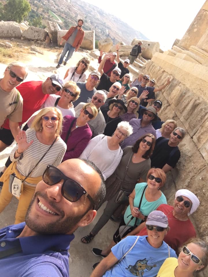 In addition to being a skilled tour guide, Sam Zyoud, foreground, has mastered the art of the group selfie