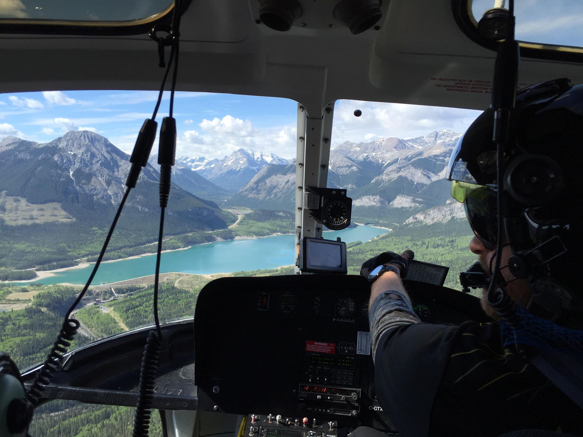 An exhilarating helicopter ride above Banff, Alberta reveals turquoise lakes and snowcapped peaks.